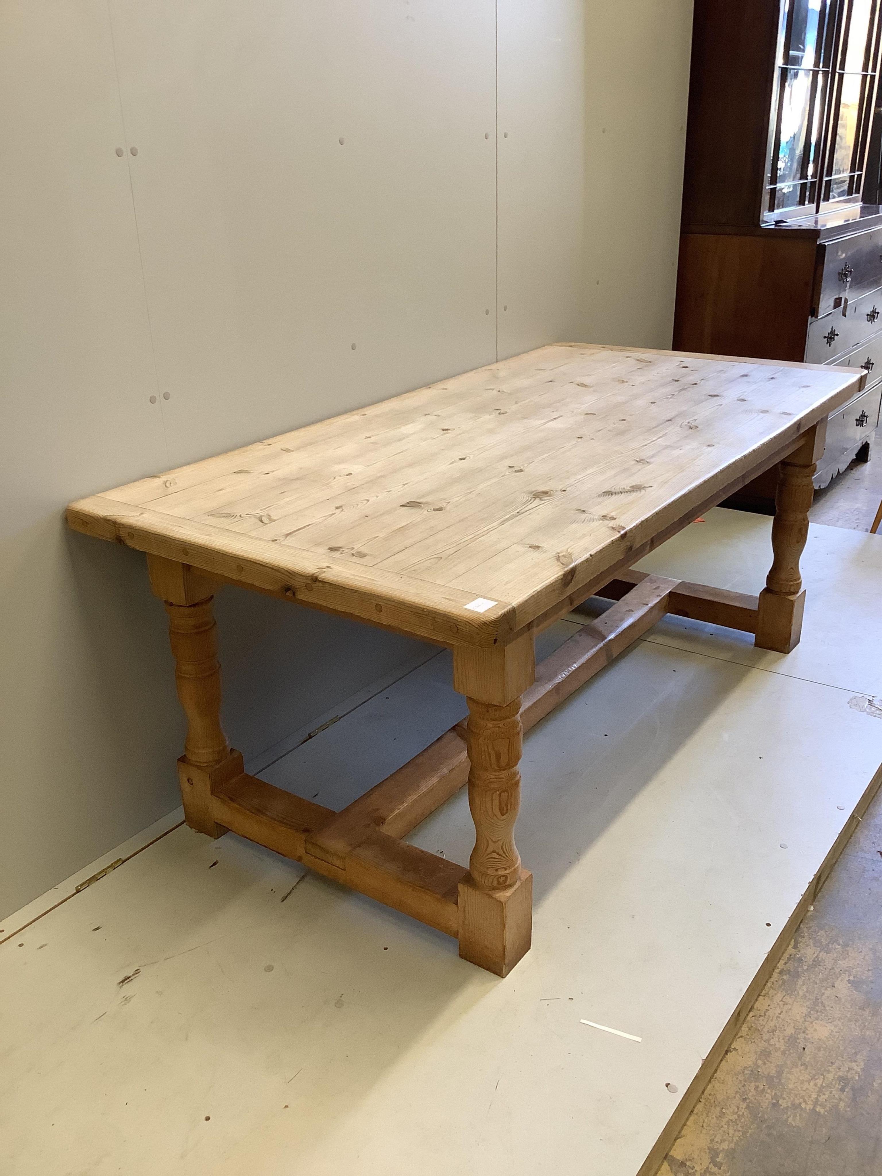 An 18th century style rectangular pine refectory dining table, width 182cm, depth 91cm, height 74cm. Condition - fair